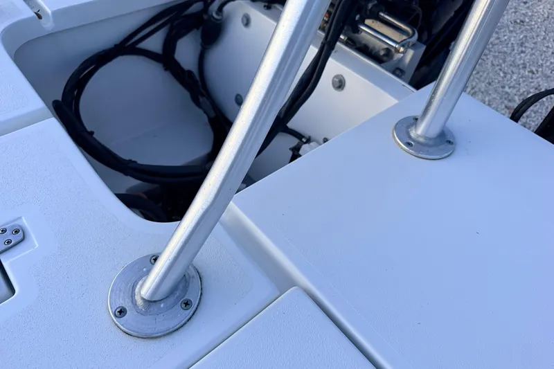 Slide: The Image of Close-up of 2019 Mitzi Skiffs 17 boat deck with metal supports and wiring. - 61