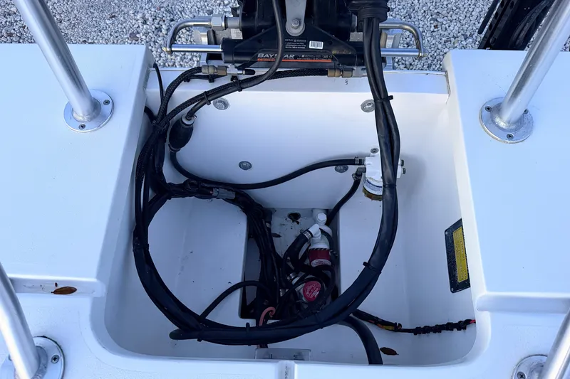 Slide: The Image of 2019 Mitzi Skiffs 17 boat wiring and engine compartment detail. - 63