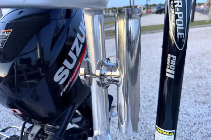 Slide: The Image of Boat motor and accessories on a 2019 Mitzi Skiffs 17, featuring Suzuki engine and Power-Pole anchor. - 68