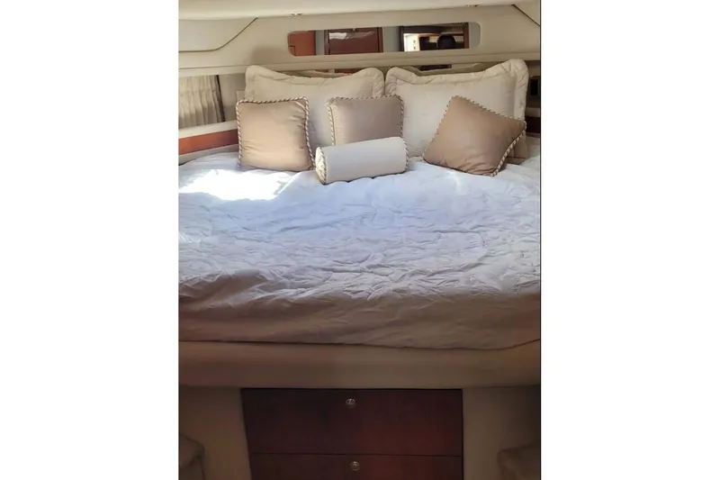 Slide: The Image of Luxurious cabin interior of 1999 Sea Ray Sundancer 460 yacht with plush bedding. - 10