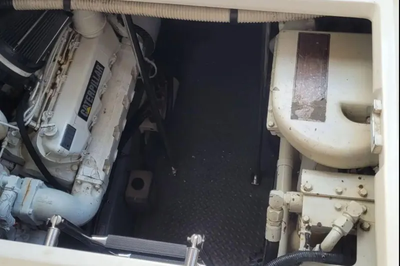Slide: The Image of Engine compartment of a 1999 Sea Ray Sundancer 460 with Caterpillar engine. - 12