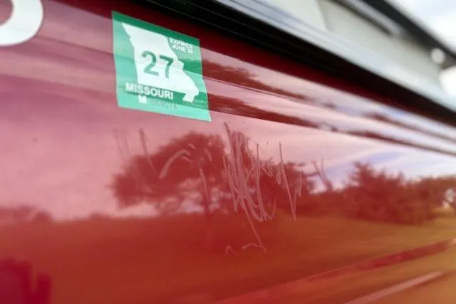 Slide: The Image of 2024 Regency 250 DL3 with Missouri registration sticker, reflecting outdoor scenery. - 17