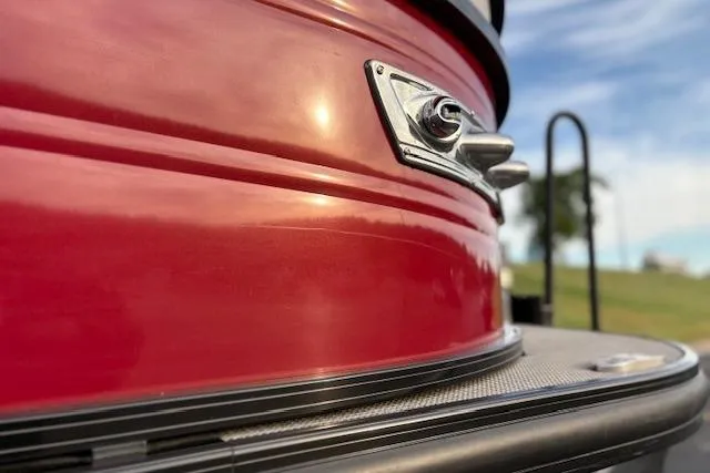 Slide: The Image of 2024 Regency 250 DL3 boat detail, featuring sleek red exterior and chrome accents. - 27