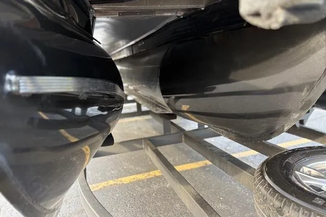 Slide: The Image of Underneath view of a 2024 Regency 250 DL3 pontoon boat on a trailer. - 30