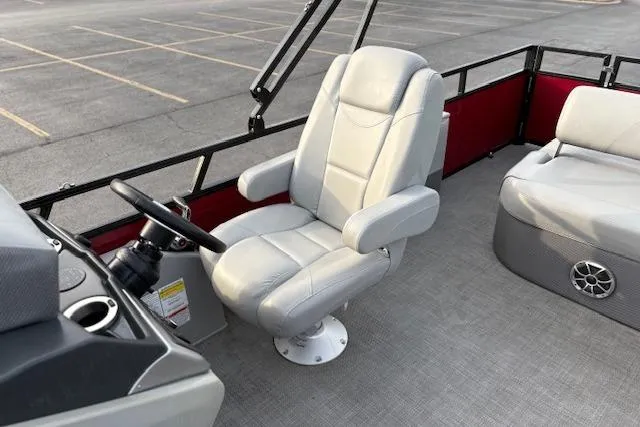 Slide: The Image of Captain's chair on 2024 Regency 250 DL3 pontoon boat, featuring sleek design and comfortable seating. - 34