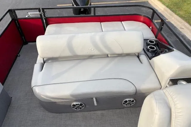 Slide: The Image of 2024 Regency 250 DL3 boat interior with gray seating and cup holders. - 35