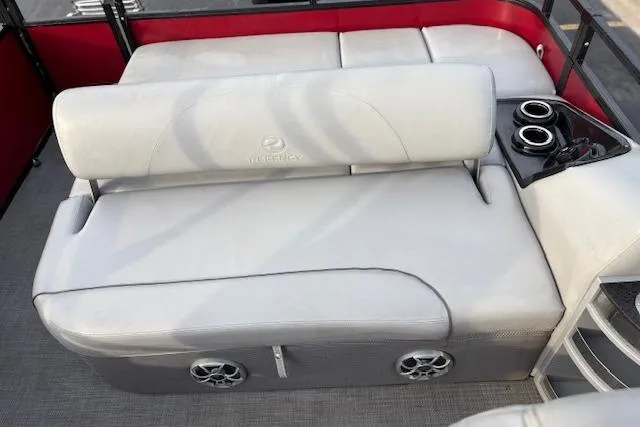 Slide: The Image of 2024 Regency 250 DL3 boat interior with gray seating and cup holders. - 41