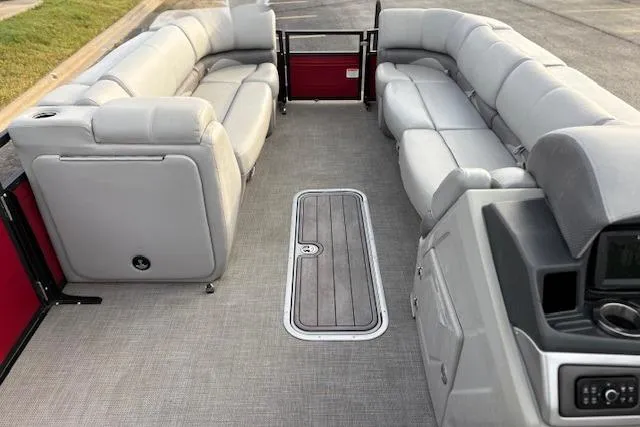 Slide: The Image of 2024 Regency 250 DL3 pontoon boat interior with plush seating and modern design. - 43