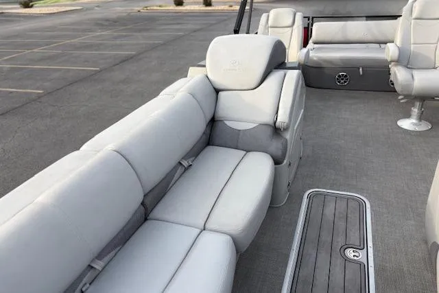 Slide: The Image of 2024 Regency 250 DL3 pontoon boat interior with plush seating and modern design. - 45