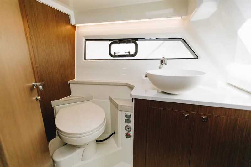 Slide: The Image of Luxurious bathroom interior of 2026 Beneteau Antares 9 yacht, featuring modern fixtures and wood accents. - 19