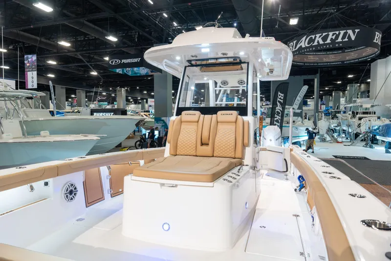 Slide: The Image of 2027 Caymas 29 CT boat displayed at a trade show. - 10