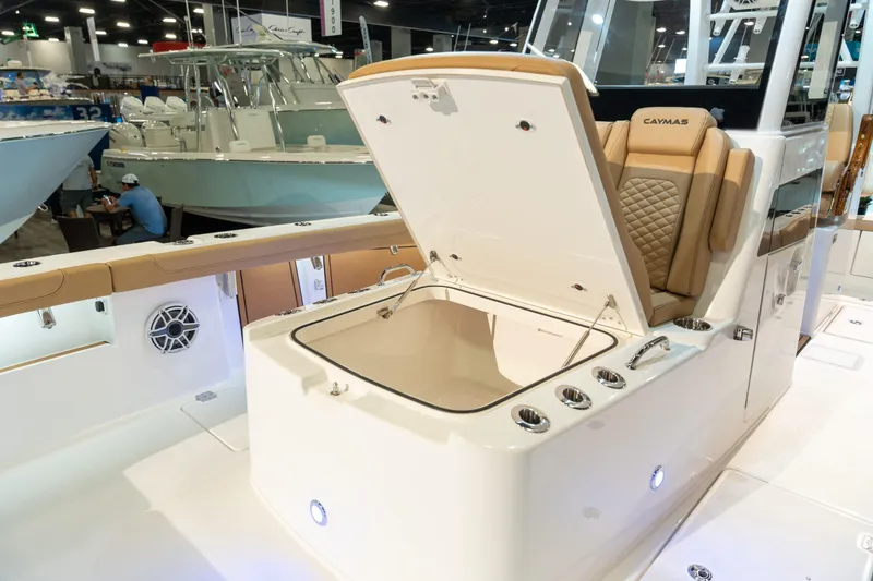 Slide: The Image of 2027 Caymas 29 CT boat with open storage compartment lid. - 12