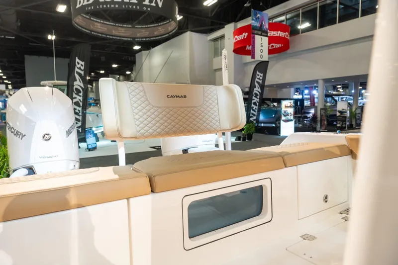 Slide: The Image of Caymas 29 CT 2027 boat with Mercury engines at a trade show. - 17