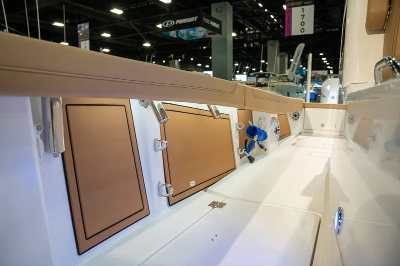 Slide: The Image of Interior view of 2027 Caymas 29 CT boat at a trade show. - 19