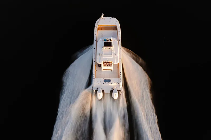 Slide: The Image of Aerial view of Caymas 29 CT boat on water, year 2027. - 4