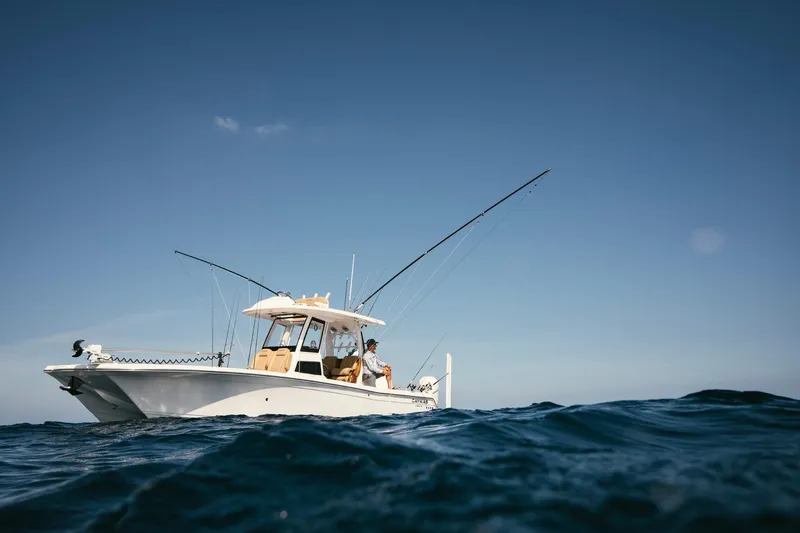 Slide: The Image of 2027 Caymas 29 CT boat on open sea, fishing. - 6