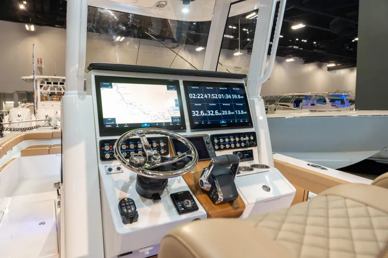 Slide: The Image of Caymas 29 CT 2027 boat console with modern navigation. - 9