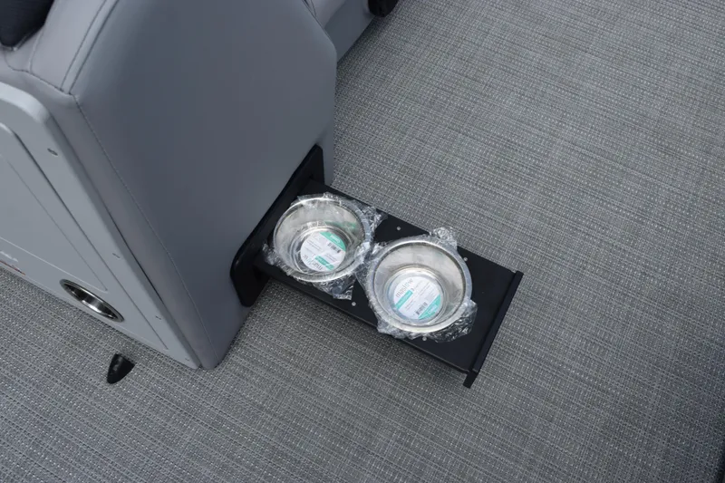 Slide: The Image of 2026 Bentley Pontoons Legacy 243 Swingback with retractable cup holders on gray flooring. - 13