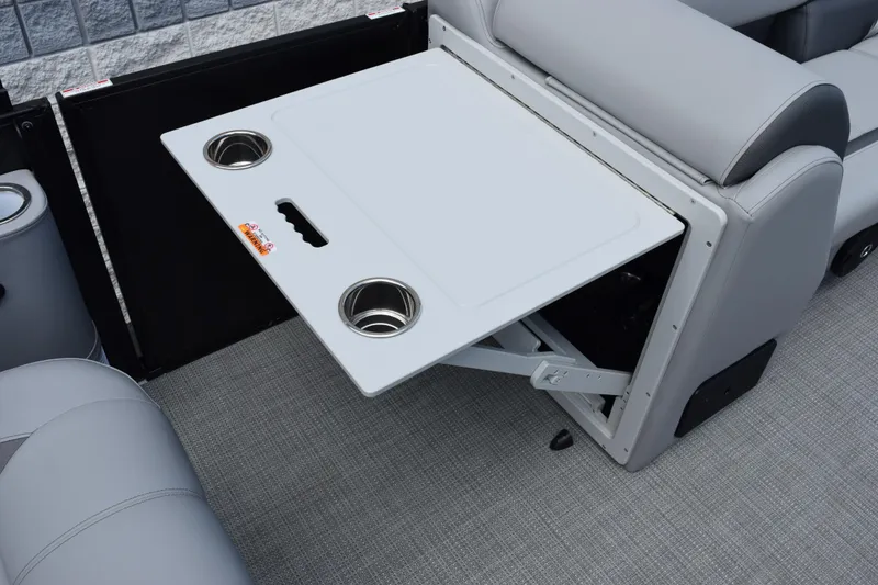 Slide: The Image of 2026 Bentley Pontoons Legacy 243 Swingback interior with foldable table and cup holders. - 14