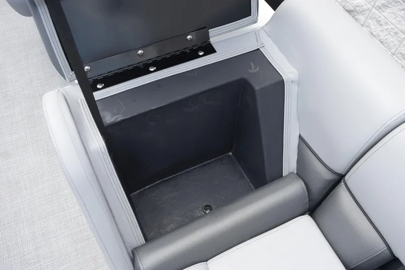 Slide: The Image of Storage compartment in 2026 Bentley Pontoons Legacy 243 Swingback boat, featuring sleek upholstery. - 16