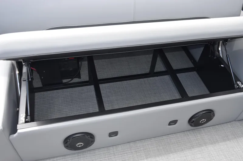 Slide: The Image of Storage compartment in 2026 Bentley Pontoons Legacy 243 Swingback, featuring sleek design and integrated speakers. - 18