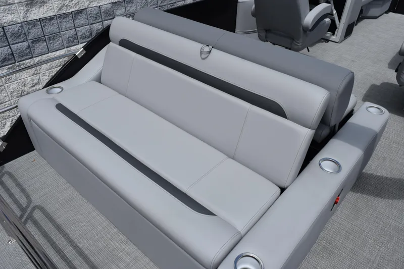 Slide: The Image of 2026 Bentley Pontoons Legacy 243 Swingback with luxurious gray seating and cup holders. - 20