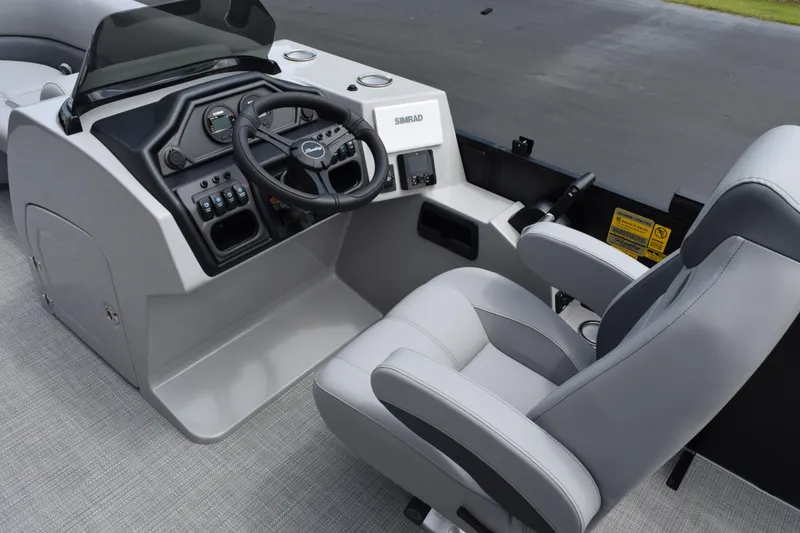 Slide: The Image of 2026 Bentley Pontoons Legacy 243 Swingback helm with modern controls and comfortable seating. - 8