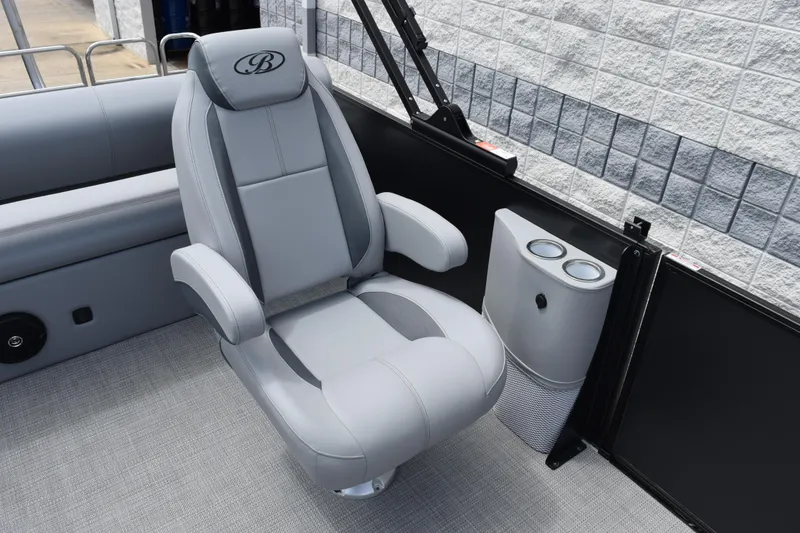 Slide: The Image of 2026 Bentley Pontoons Legacy 243 Swingback interior with luxurious gray seating and cup holders. - 9
