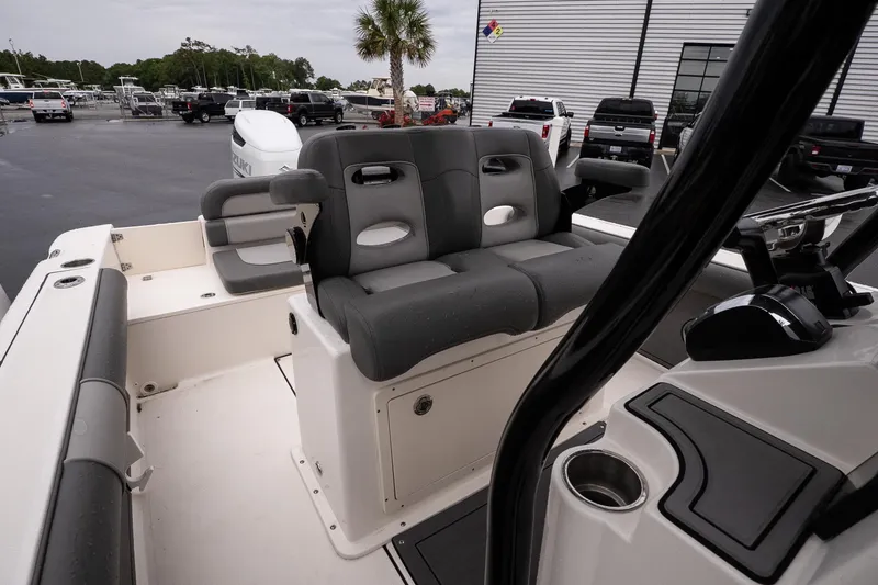 Slide: The Image of 2022 Sea Born LX24 Center Console boat interior with seating and control panel. - 10