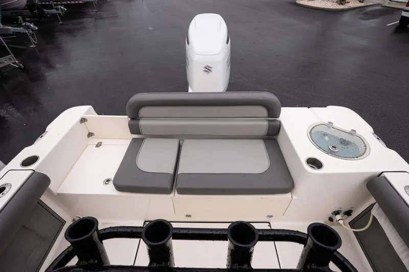 Slide: The Image of 2022 Sea Born LX24 Center Console boat interior with seating and fishing rod holders. - 11