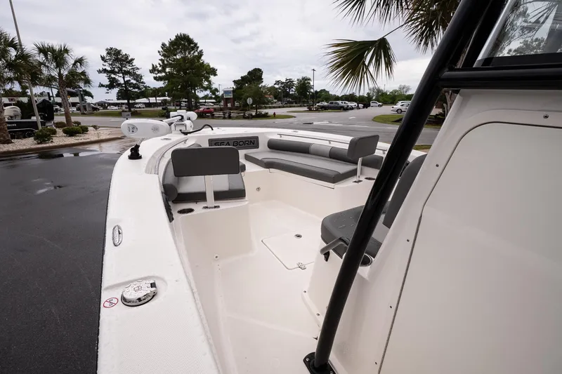 Slide: The Image of 2022 Sea Born LX24 Center Console boat with seating, parked outdoors. - 13