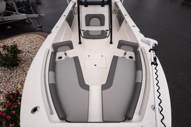 Slide: The Image of 2022 Sea Born LX24 Center Console boat interior with gray seating and white deck. - 14