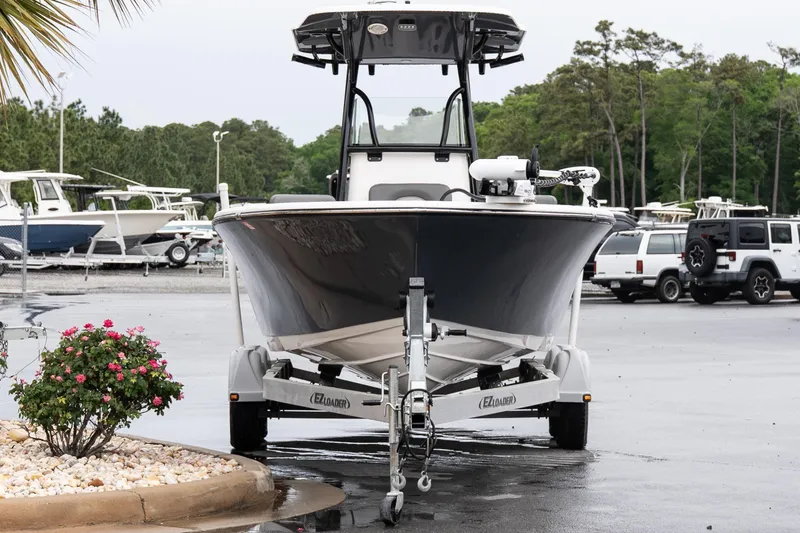 Slide: The Image of 2022 Sea Born LX24 Center Console boat on trailer in parking lot. - 3