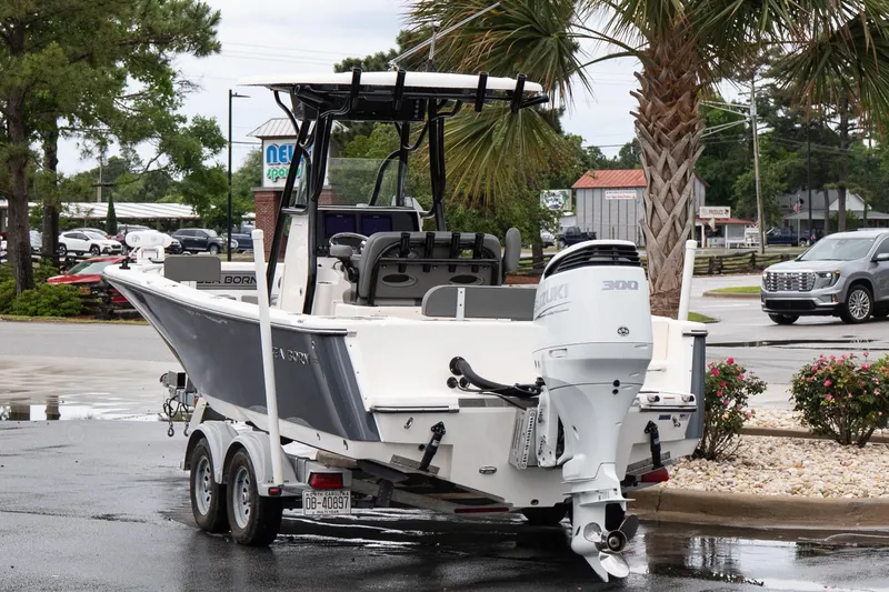 Slide: The Image of 2022 Sea Born LX24 Center Console boat with Suzuki 300 engine on a trailer. - 4