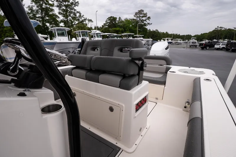 Slide: The Image of 2022 Sea Born LX24 Center Console boat interior with seating and steering wheel. - 9