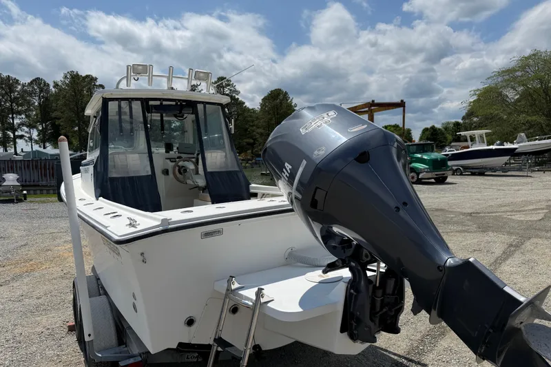 Slide: The Image of 2013 Steiger Craft 23 Miami boat with Yamaha outboard motor, parked on a trailer. - 16
