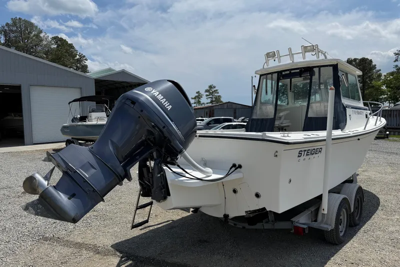 Slide: The Image of 2013 Steiger Craft 23 Miami boat with Yamaha outboard motor on trailer. - 19