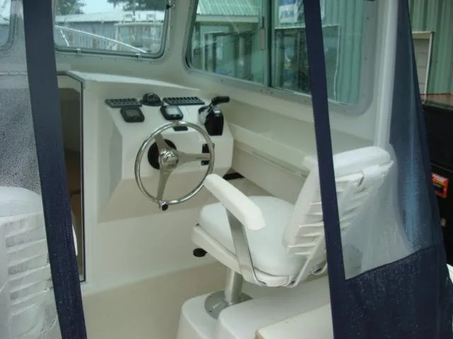 Slide: The Image of Interior of a 2013 Steiger Craft 23 Miami boat with helm station. - 3