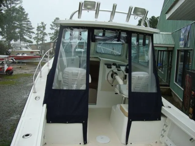 Slide: The Image of 2013 Steiger Craft 23 Miami boat with enclosed cabin. - 5