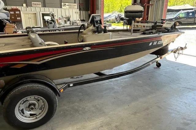 Slide: The Image of 2011 G3 Eagle 180 boat on trailer in a garage setting. - 10