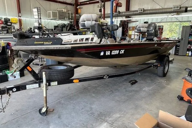Slide: The Image of 2011 G3 Eagle 180 boat on trailer in a garage setting. - 14
