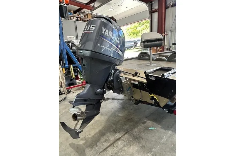 Slide: The Image of 2011 G3 Eagle 180 boat with Yamaha 115 outboard motor in a garage setting. - 17