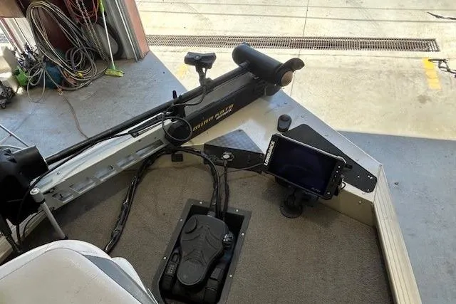 Slide: The Image of Interior of a 2011 G3 Eagle 180 boat with trolling motor and electronic display. - 6