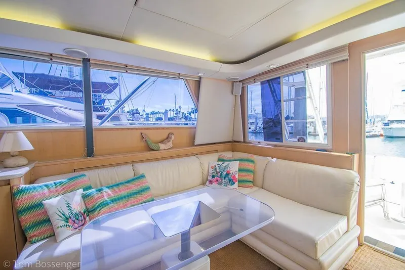 Slide: The Image of Luxurious interior of 1993 Tiara Yachts 4300 Convertible with plush seating and marina view. - 12