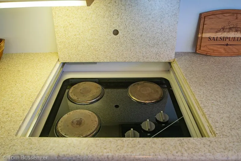 Slide: The Image of Electric stove in 1993 Tiara Yachts 4300 Convertible kitchen, with beige countertop. - 19