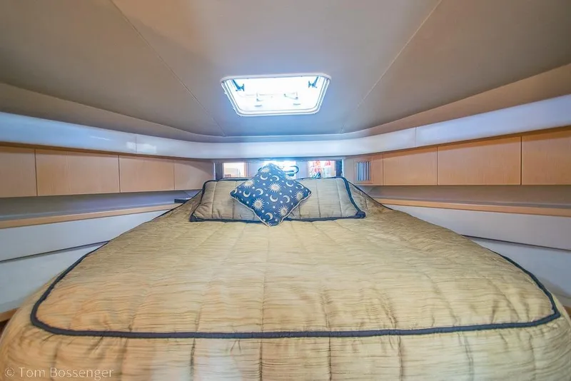 Slide: The Image of Luxurious cabin interior of 1993 Tiara Yachts 4300 Convertible with cozy bedding. - 27