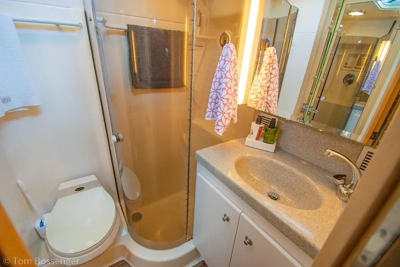 Slide: The Image of Bathroom interior of 1993 Tiara Yachts 4300 Convertible, featuring shower and sink. - 31
