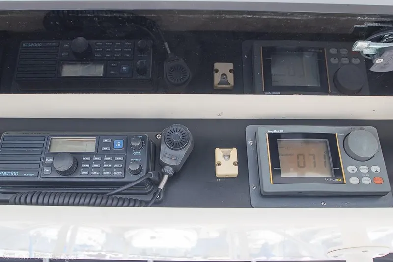 Slide: The Image of Control panel of a 1993 Tiara Yachts 4300 Convertible with communication and navigation equipment. - 45