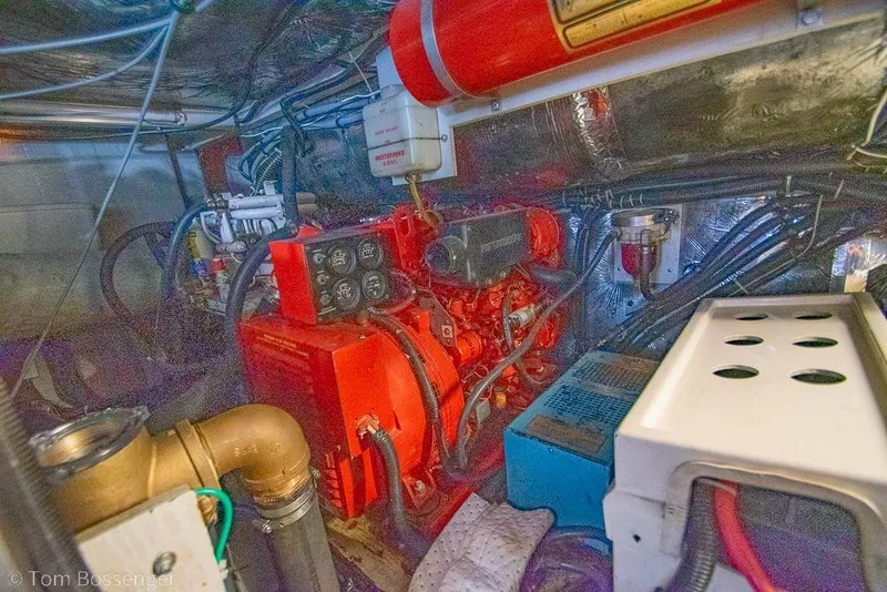 Slide: The Image of Engine room of a 1993 Tiara Yachts 4300 Convertible, showcasing mechanical components. - 58