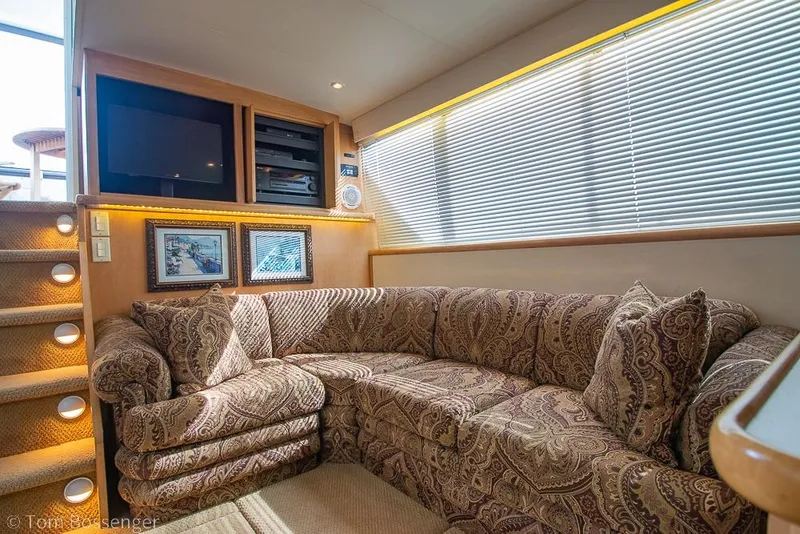 Slide: The Image of Luxurious interior of 1996 Carver 370 Aft Cabin Motor Yacht with plush seating. - 10